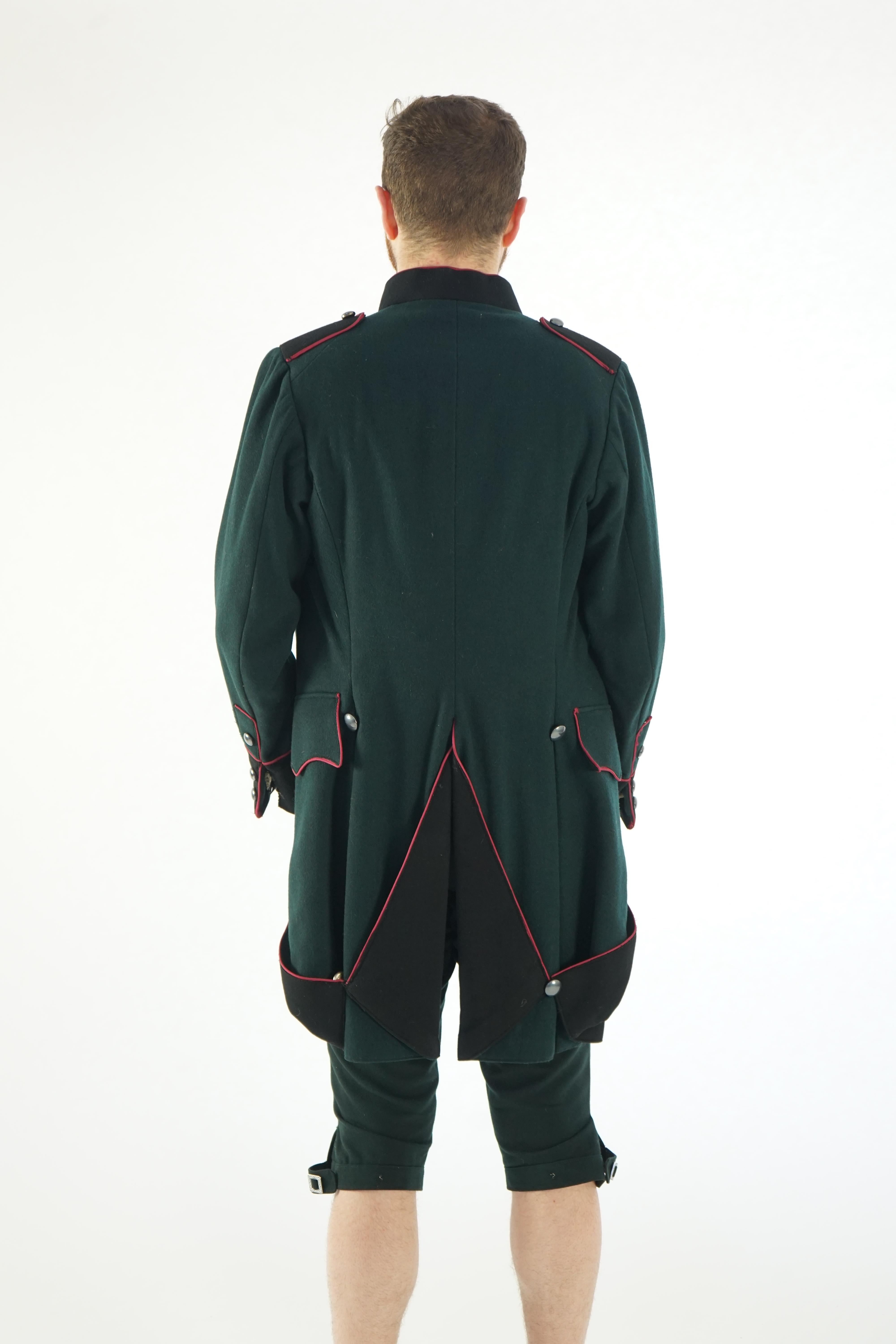 A dark green and black 18th Century style military uniform (jacket, waistcoat and breeches). Ex Royal Opera House - Soldier 'The Barber of Seville' 1993